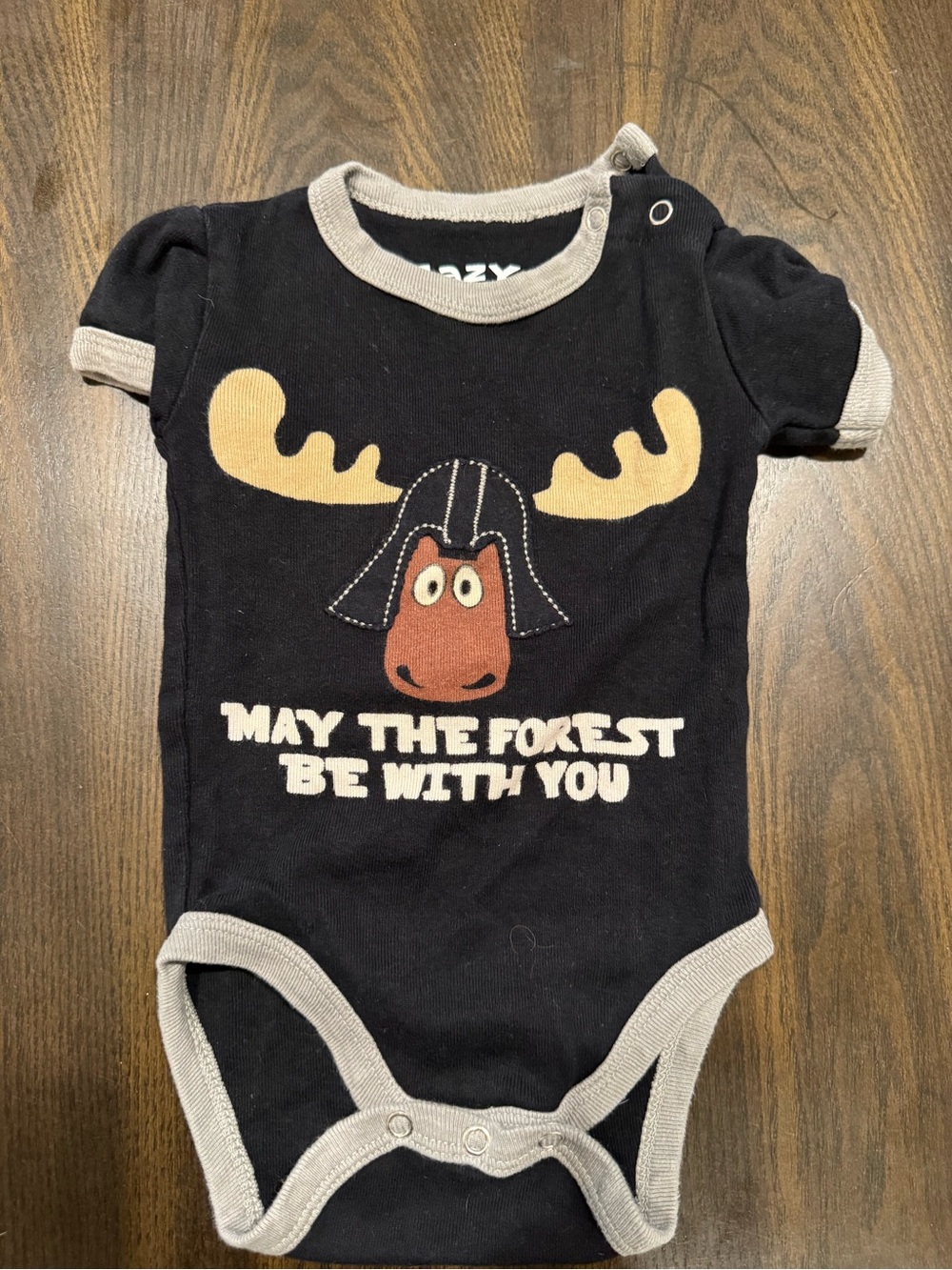 Lazy One Black Moose Graphic One-Piece Bodysuit with Cream Trim
